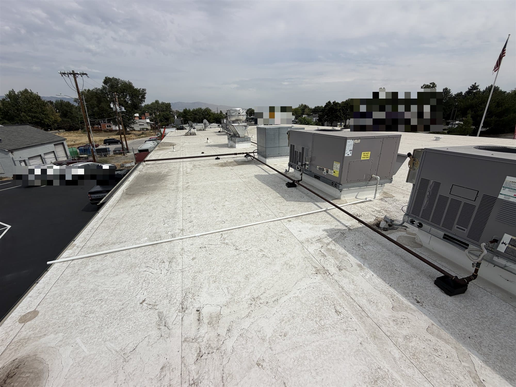 Row of commercial rooftop HVAC units on a Boise-area building roof