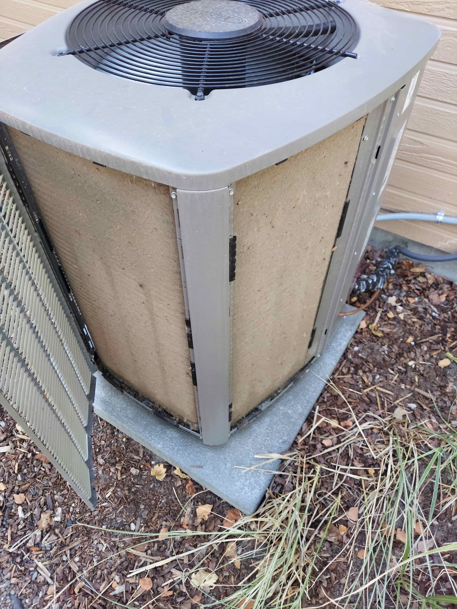 Clogged AC condenser coil before maintenance