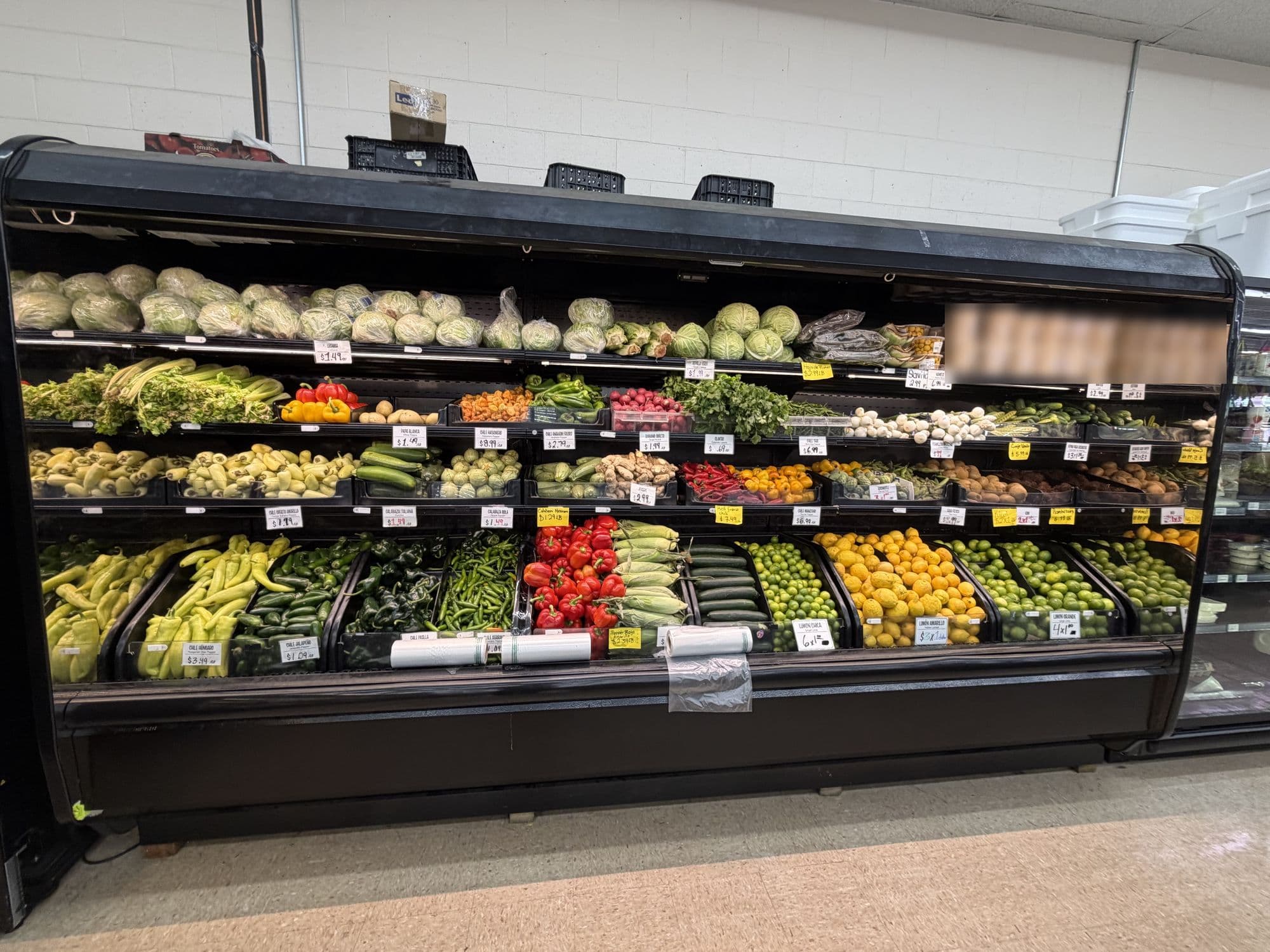 Refrigerated produce display case in a grocery store