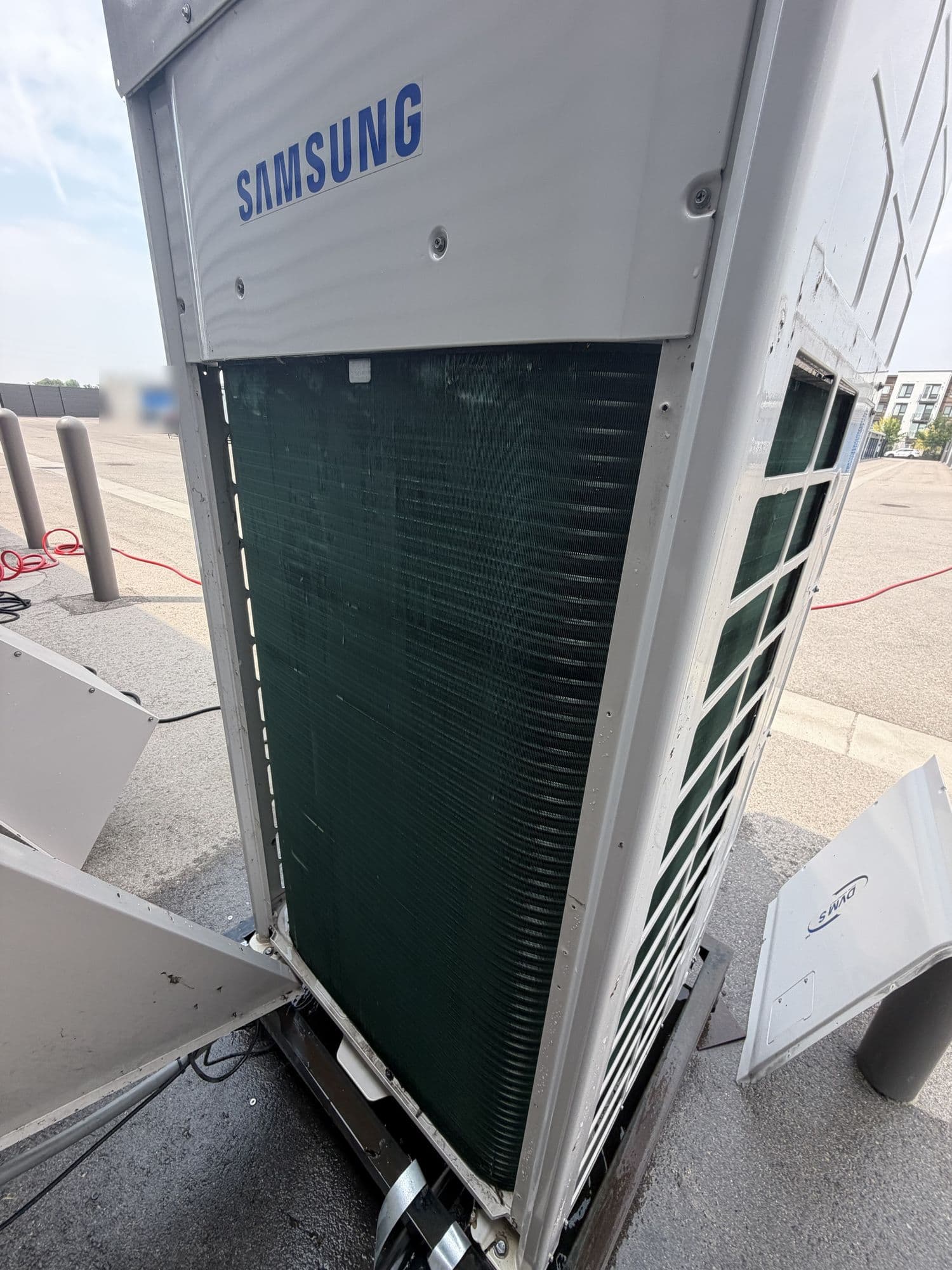 VRF outdoor unit with its side panels removed for service