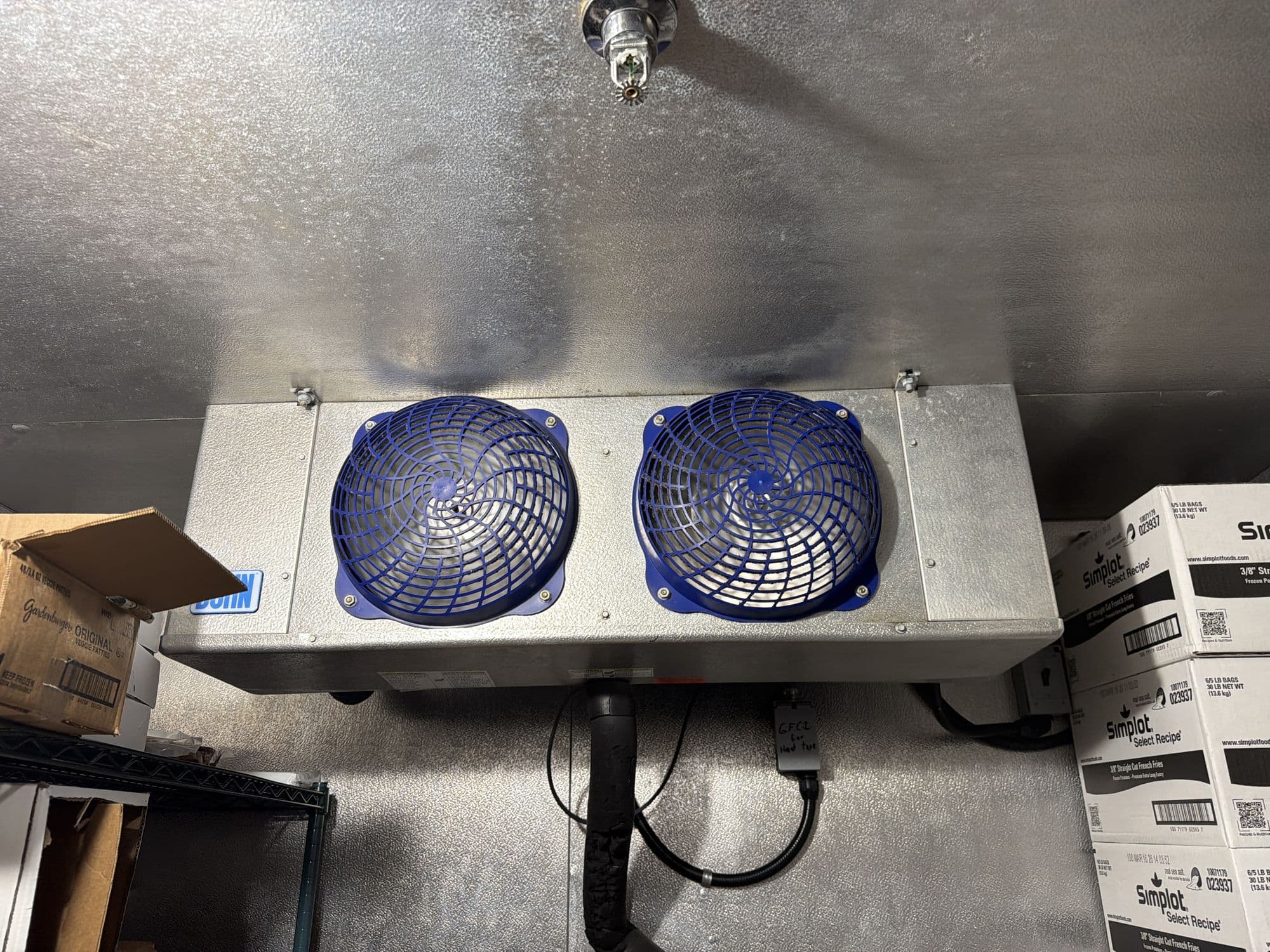 Evaporator coil and fans inside a commercial walk-in