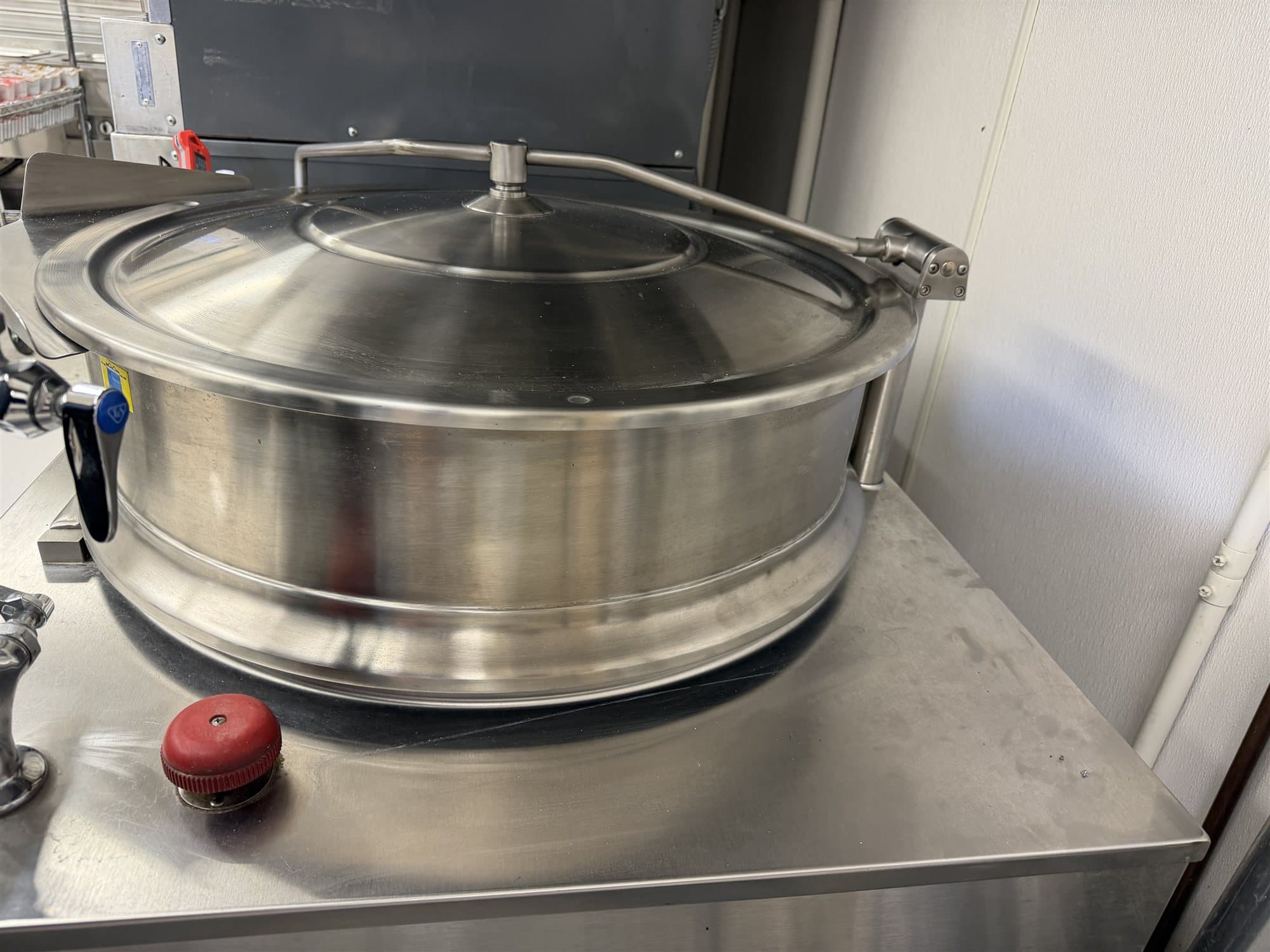 Tilting steam kettle in a commercial school kitchen