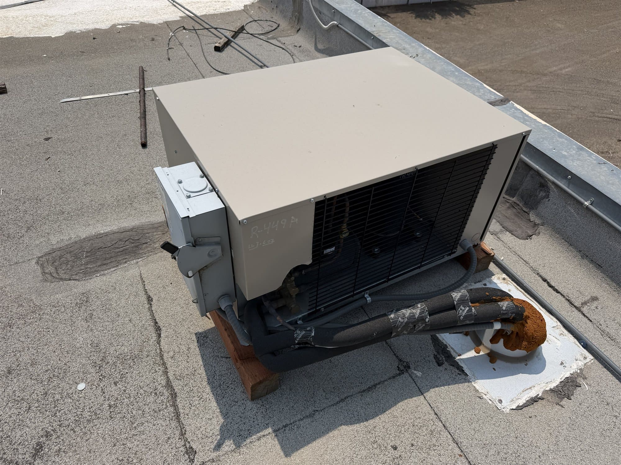 Walk-in cooler condensing unit on a commercial roof, the first part to check when deciding repair or replace