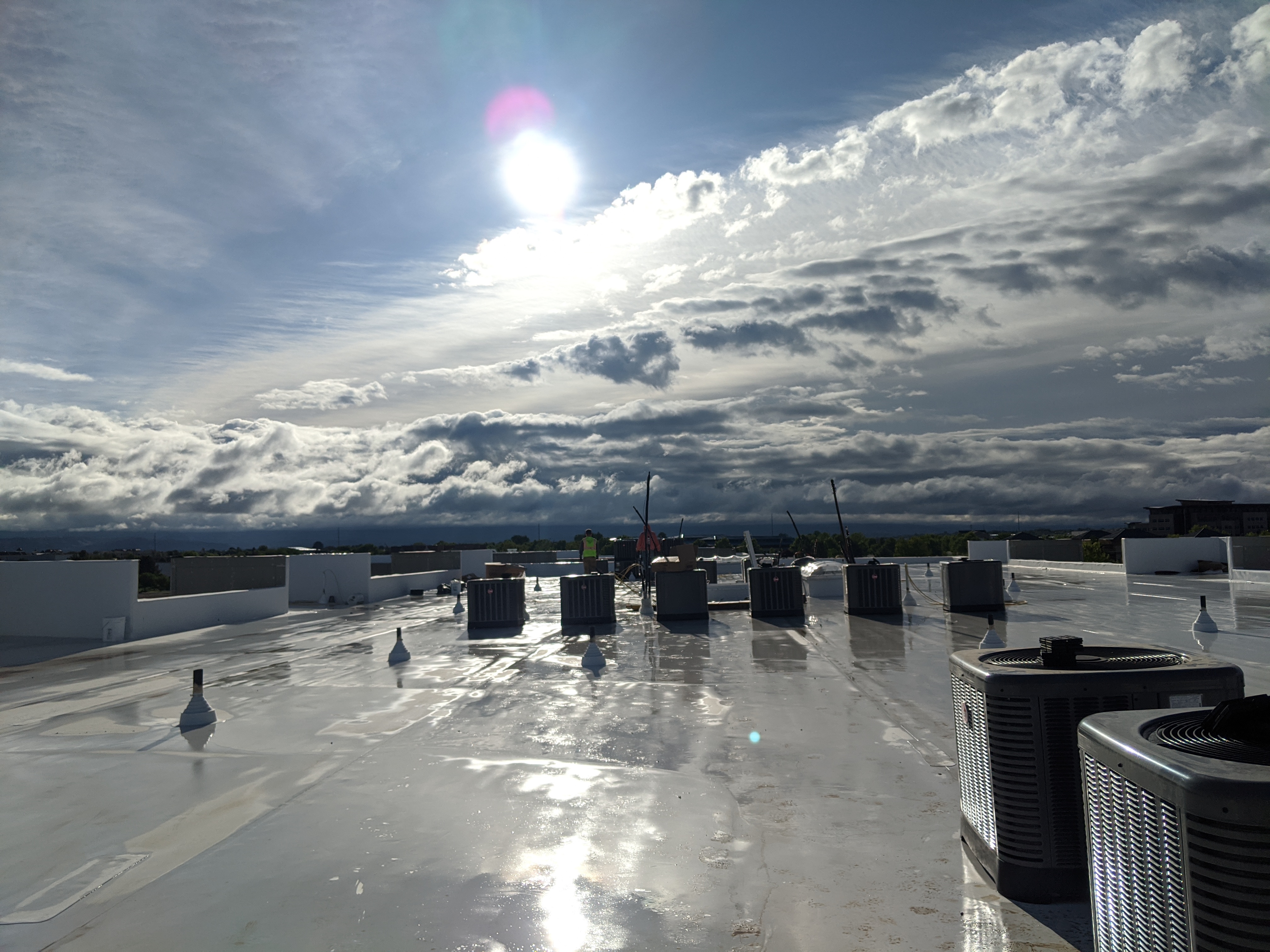 Commercial rooftop HVAC units on building serviced by Meridian HVAC